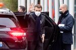 Emmanuel Macron, France's president, center, waves as he arrives at the Chanel 19M campus, home to some of its heritage suppliers, in Aubervilliers, France, on Thursday, Jan. 20, 2022. 19M is a design initiative from Chanel which covers 25,000 square meters over seven floors and houses 600 people and 11 Metiers d'Art.