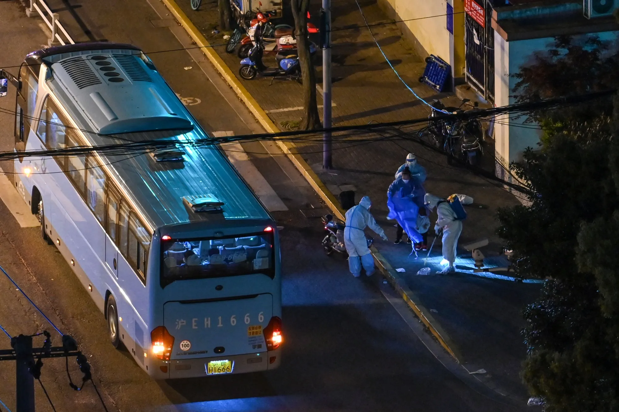 Health workers at a neighborhood during a Covid-19 lockdown in Shanghai on April 18.