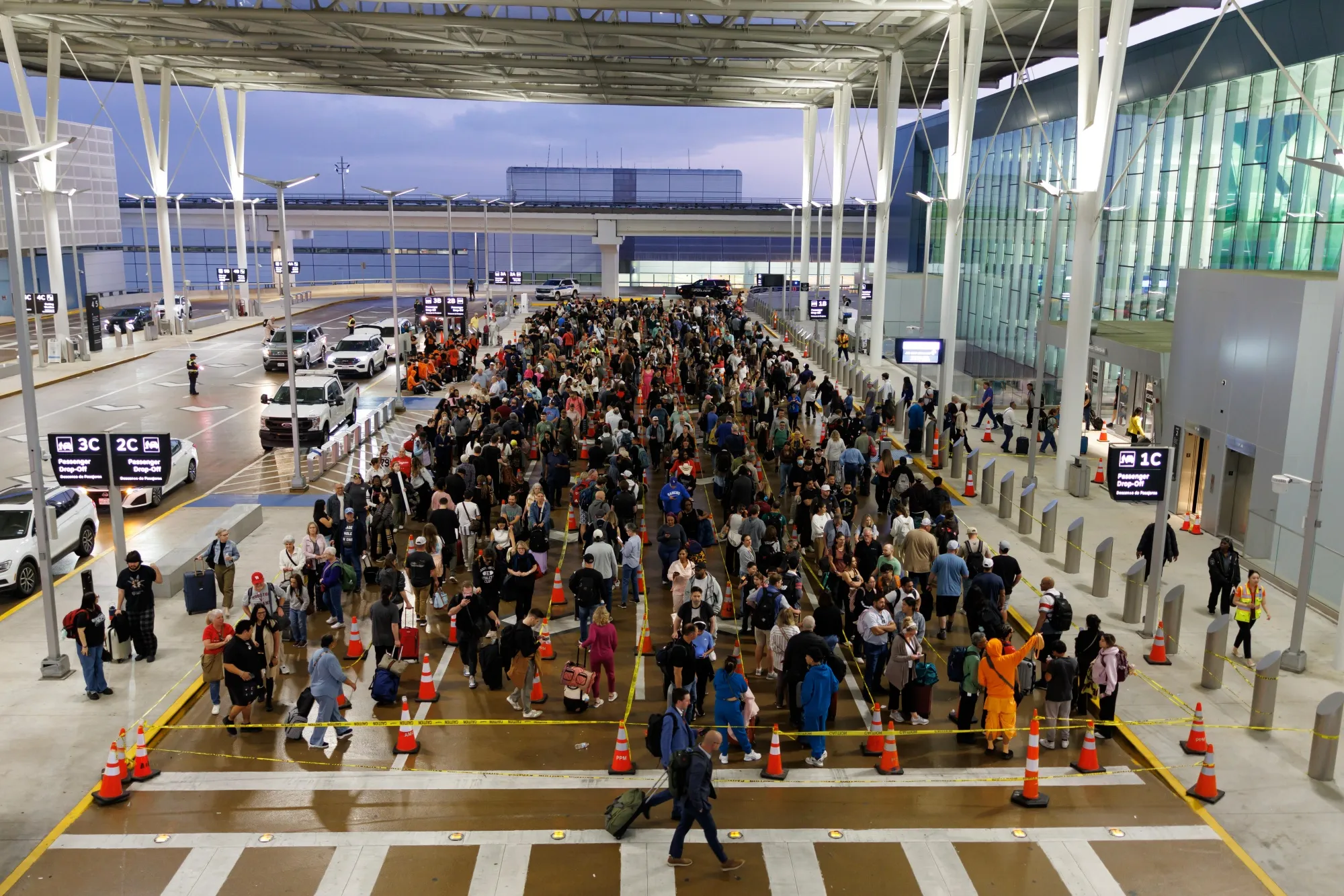 Travelers wait in line at a TSA checkpoint at George Bush Intercontinental Airport in Houston on March 26.