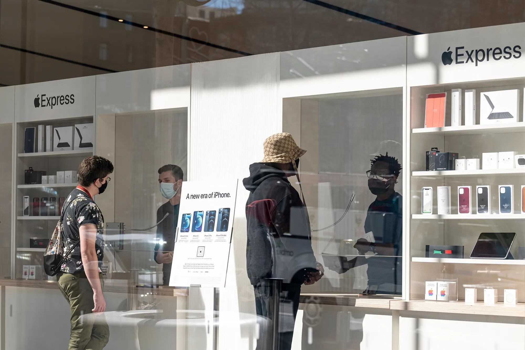 Employees assist customers&nbsp;an Apple store in San Francisco&nbsp;on Feb. 17.&nbsp;