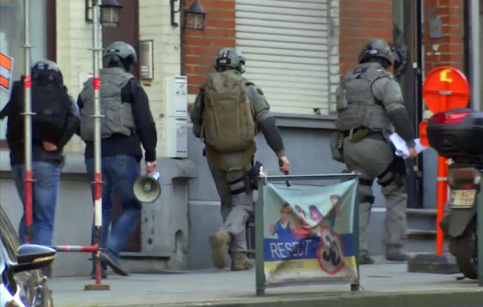 Belgium security personnel enter a building in Brussels in this image taken from TV, on&nbsp;Feb. 22, 2018.&nbsp;