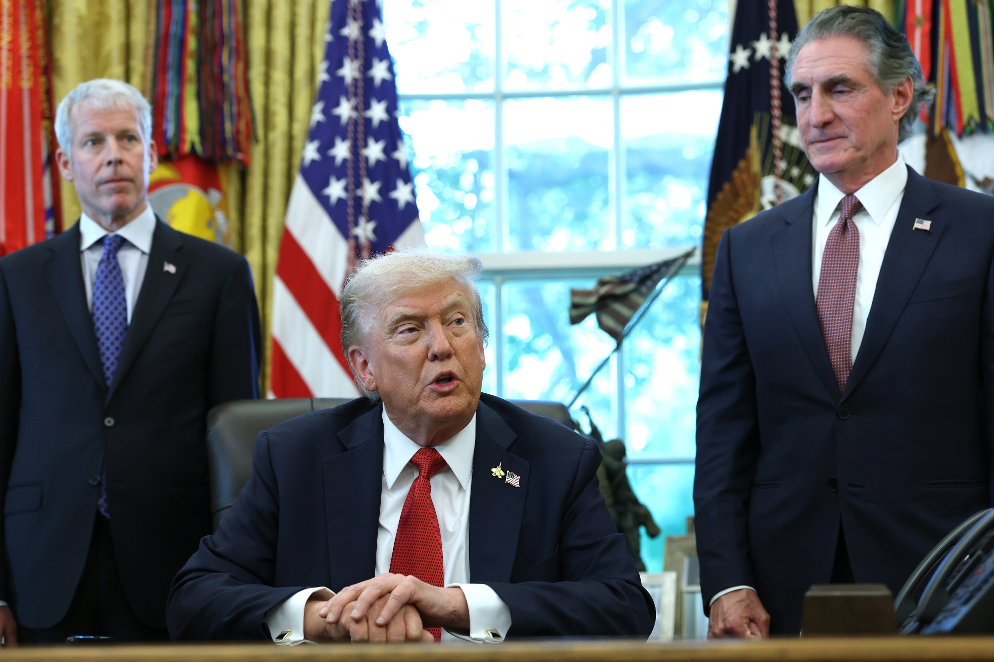 President Donald Trump with Energy Secretary Chris Wright, left, and Interior Secretary Doug Burgum, right, in the Oval Office at the White House in Washington.