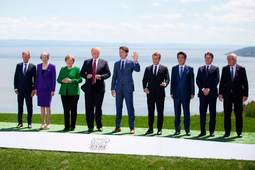 (L-R) The President of the European Council Donald Tusk, British Prime Minister Theresa May, German Chancellor Angela Merkel, US President Donald Trump, Canadian Prime Minister Justin Trudeau, French President Emmanuel Macron, Japanese Prime Minister Shinzo Abe, Italian Prime Minister Giuseppe Conte, and the President of the European Commission Jean-Claude Juncker pose for a family photo during the G7 Summit in in La Malbaie, Quebec, Canada, June 8, 2018.