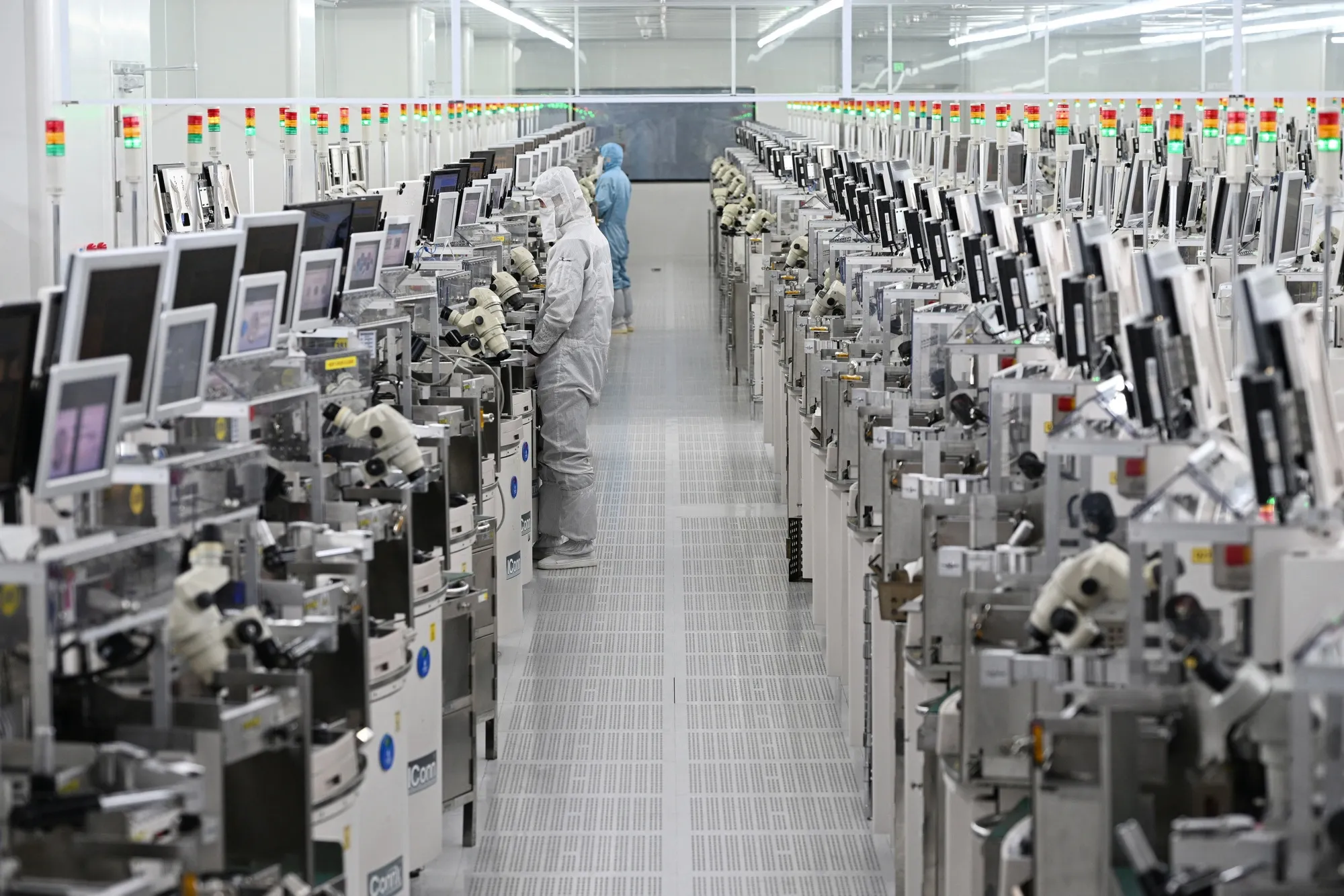 Technicians at a semiconductor manufacturing plant in Suqian, China. Beijing’s latest Five-Year Plan pivots toward a data economy.