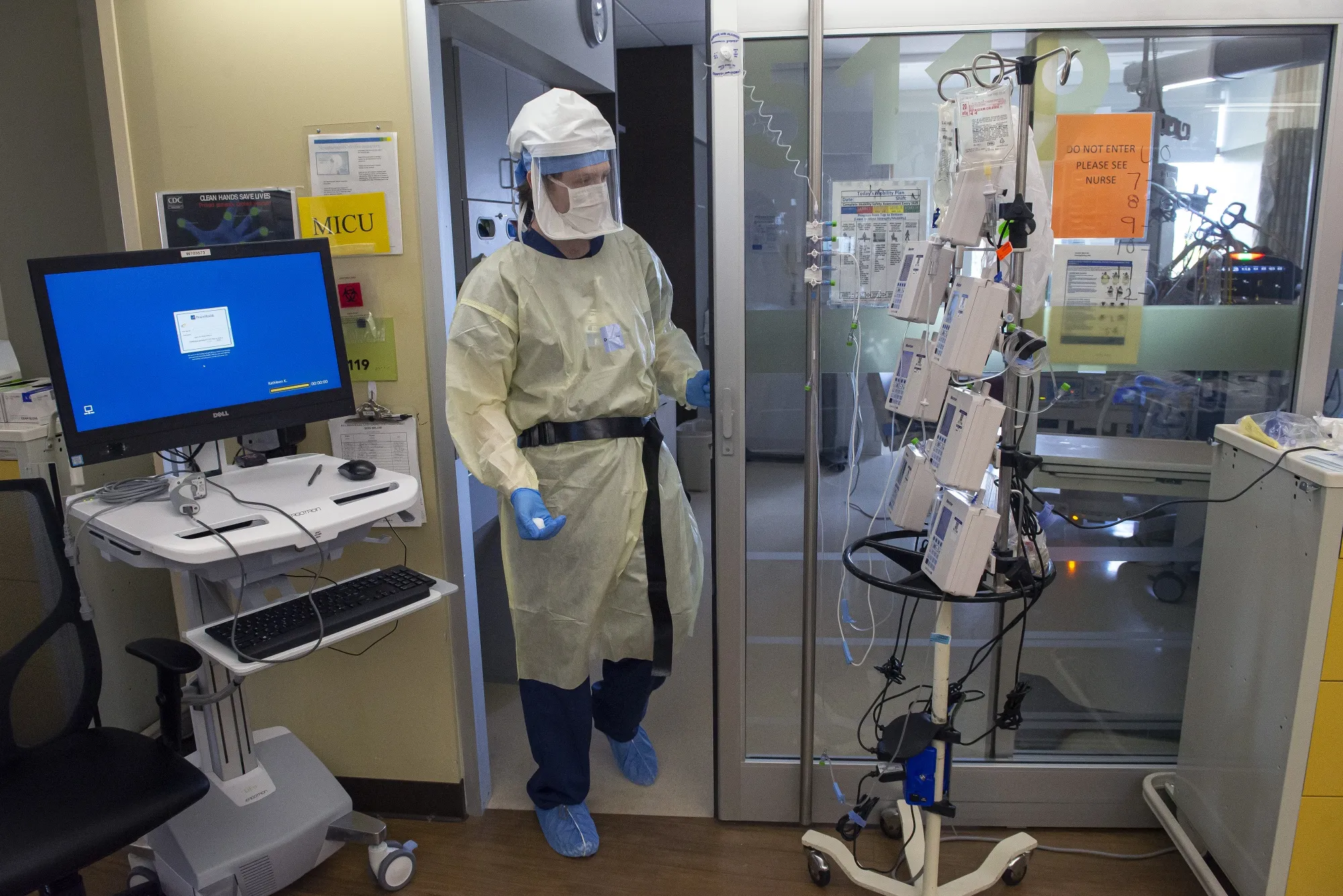 A nurse&nbsp;exits&nbsp;patient’s&nbsp;room at a hospital&nbsp;in Vancouver, Washington.