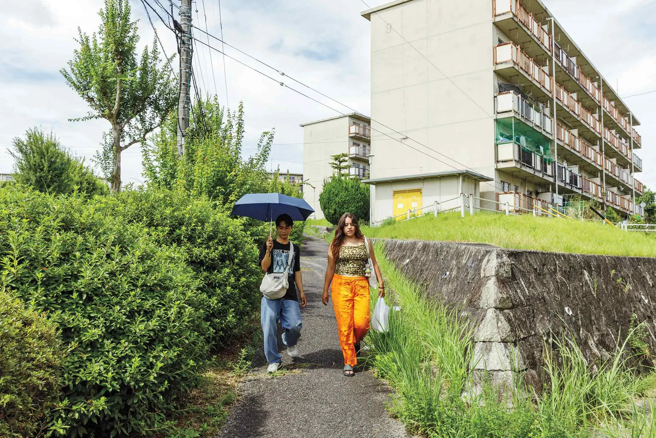 Thais Ayumi Wadaue (right), 18, whose parents are Brazilian, and her Indonesian friend, Fauzan Fatkhur Rohman, in Toyota.