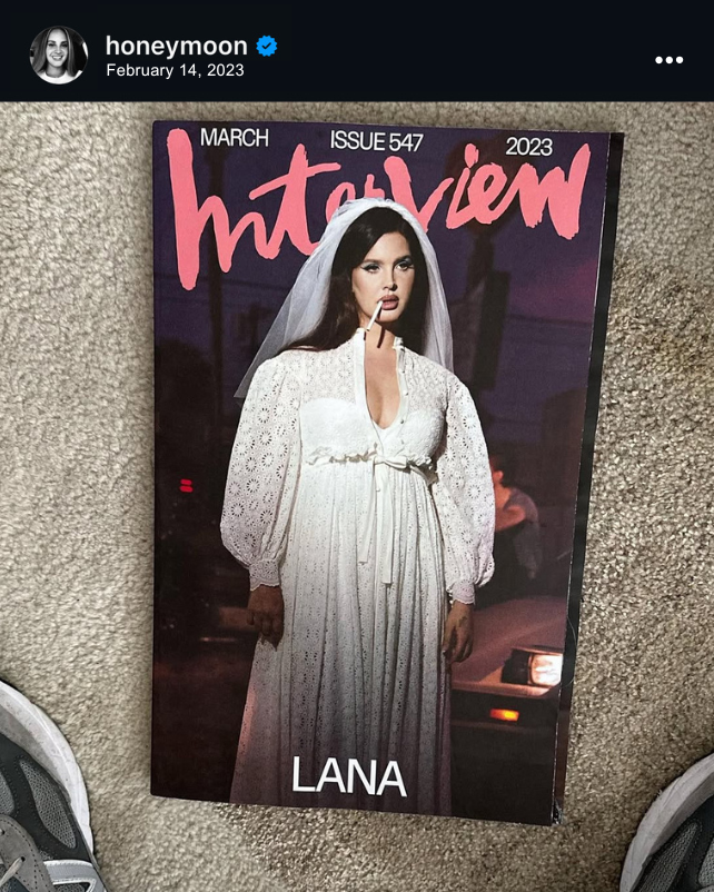 Screenshot of Instagram post by Lana Del Rey showing the March 2023 copy of Interview Magazine (Issue 547) on the ground. The Instagram post is dated February 14, 2023. The cover of the magazine features Lana Del Rey in a white wedding gown and veil with a cigarette in her mouth.
