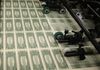 WASHINGTON, DC - MARCH 24: Sheets of one dollar bills run through the printing press at the Bureau of Engraving and Printing on March 24, 2015 in Washington, DC. The roots of The Bureau of Engraving and Printing can be traced back to 1862, when a single room was used in the basement of the main Treasury building before moving to its current location on 14th Street in 1864. The Washington printing facility has been responsible for printing all of the paper Federal Reserve notes up until 1991 when it shared the printing responsibilities with a new western facility that opened in Fort Worth, Texas. (Photo by Mark Wilson/Getty Images)