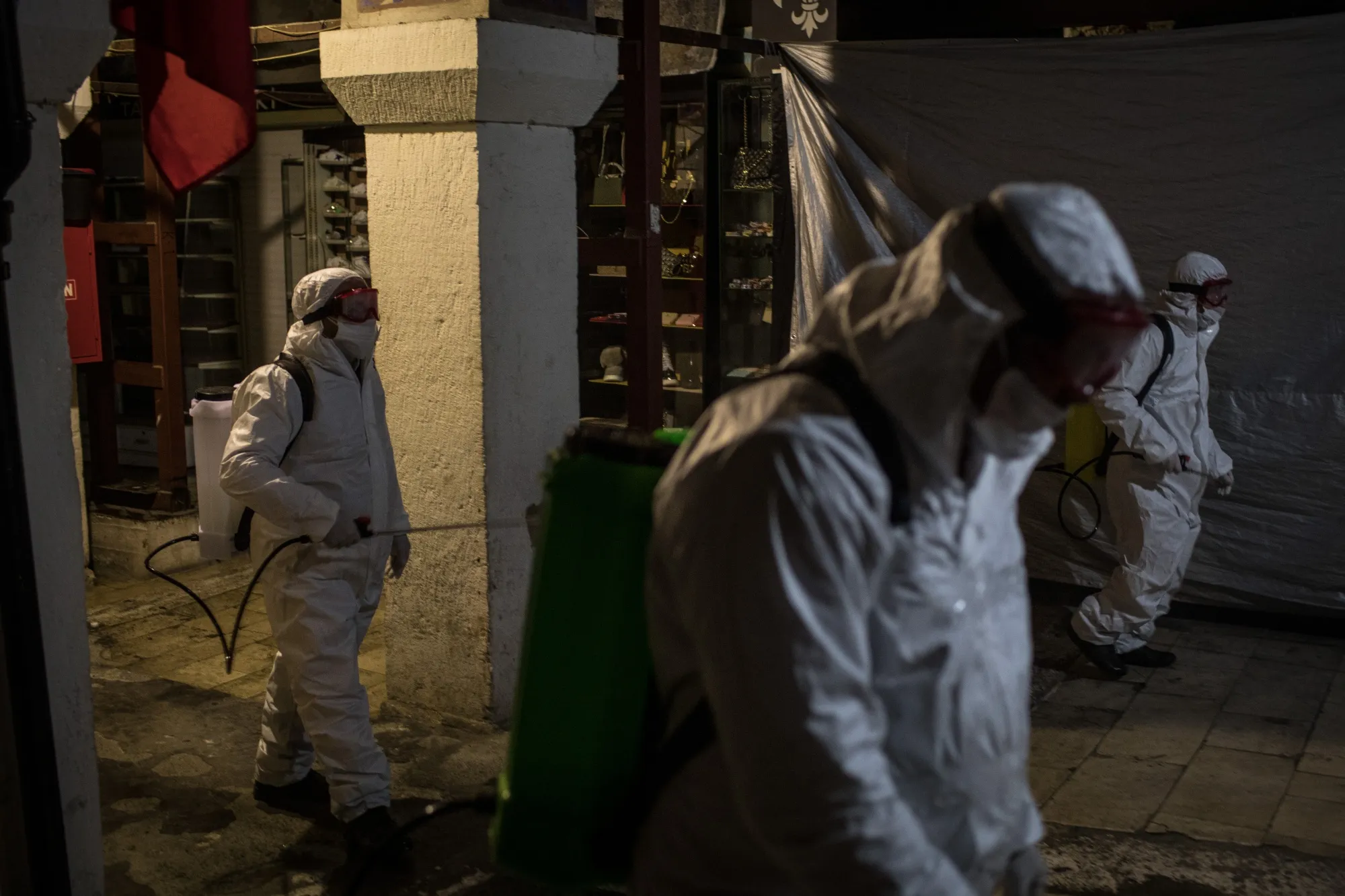 Employees disinfect the streets and shops inside Istanbul's famous Grand Bazaar in Istanbul, Turkey on March 18.