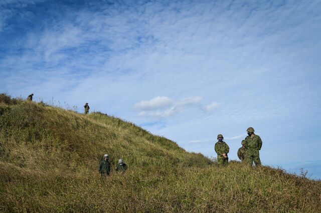 Japanese soldiers practicing an amphibious landing on Tanegashima last November.