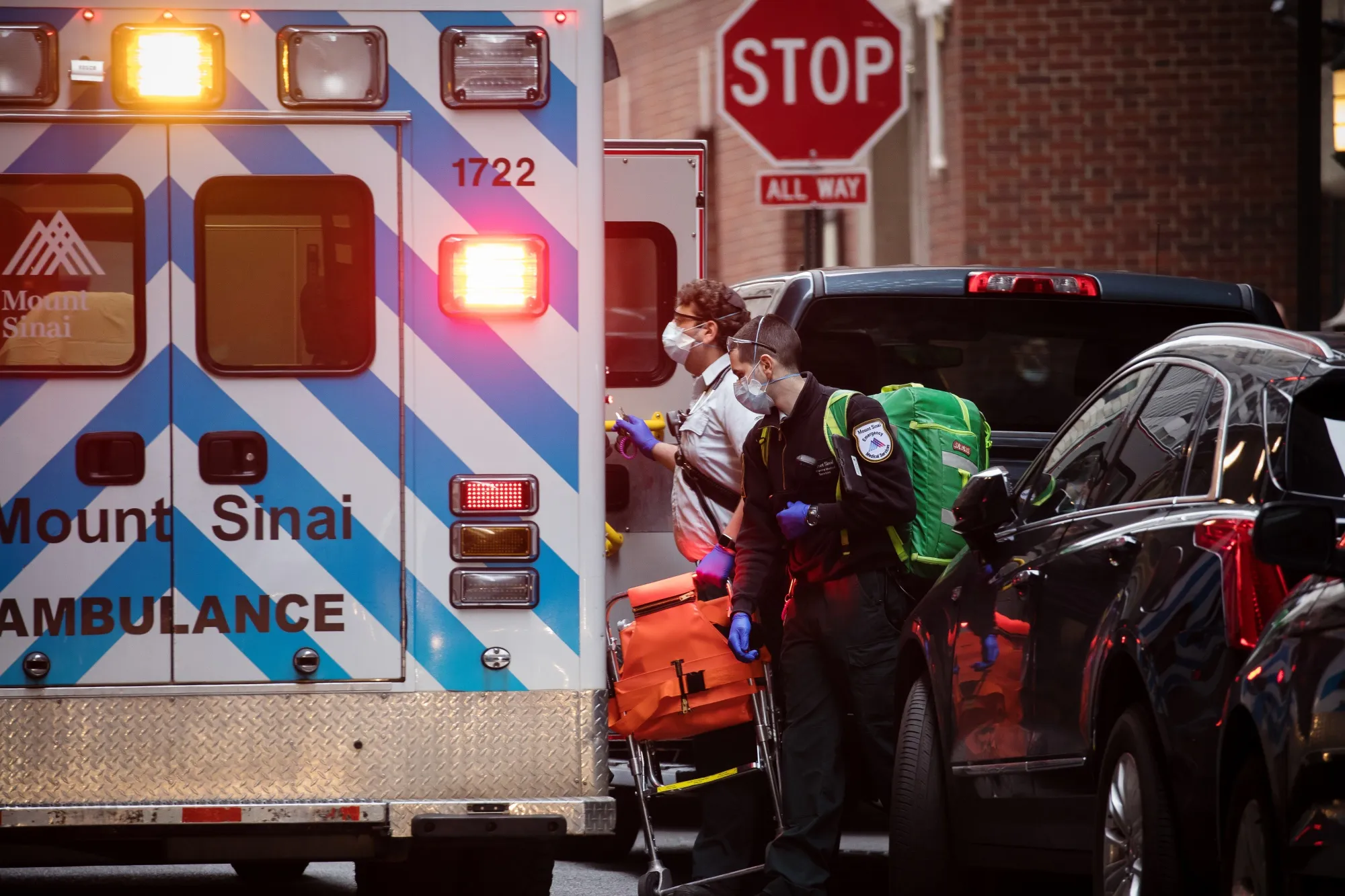 Medical workers in a Monut Sinai ambulance respond to a call in the Financial District of New York, March 30.