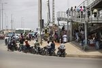 Motorcyclists parked on a street in&nbsp;Luanda, Angola, on Oct.&nbsp;19, 2021.&nbsp;