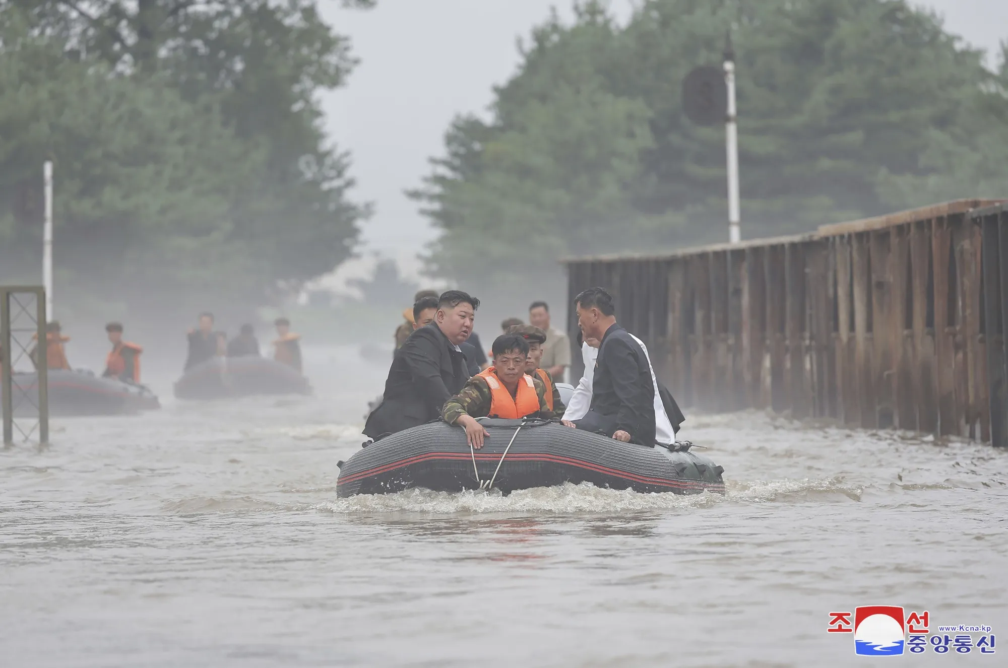 Kim Jong Un inspects a flood-hit area in Sinuiju city, North Phyongan province, in this undated photo provided by the North Korean government on July 29.