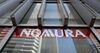 The Nomura Holdings Inc. logo is displayed outside a Nomura Securities Co. branch in Kawasaki, Kanagawa Prefecture, Japan, on Tuesday, Jan. 29, 2019.