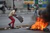 Demonstrators clash with Haitian police in Port-au-Prince, Feb. 15.