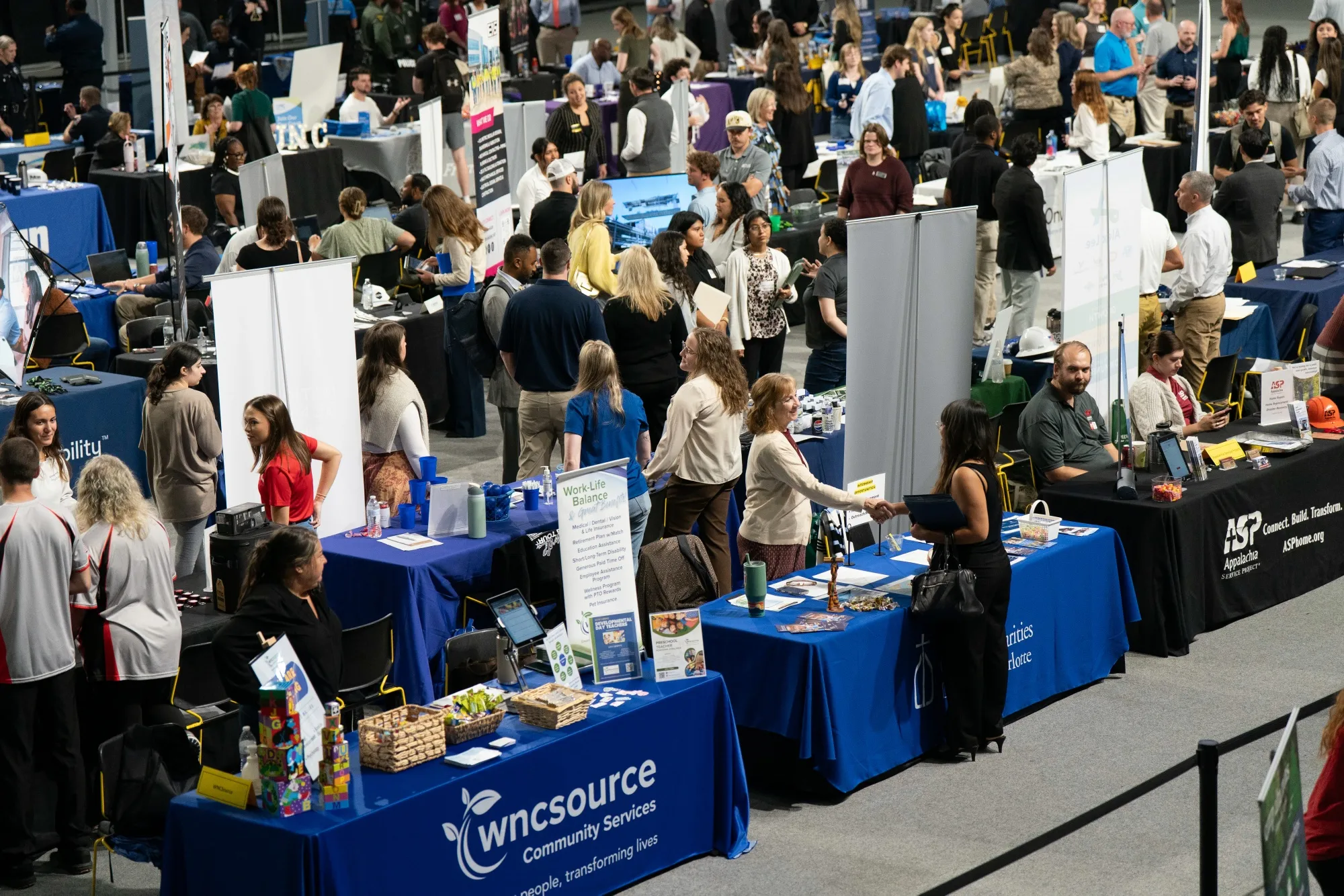Recruiters speak to job seekers at a job fair in Boone, North Carolina.
