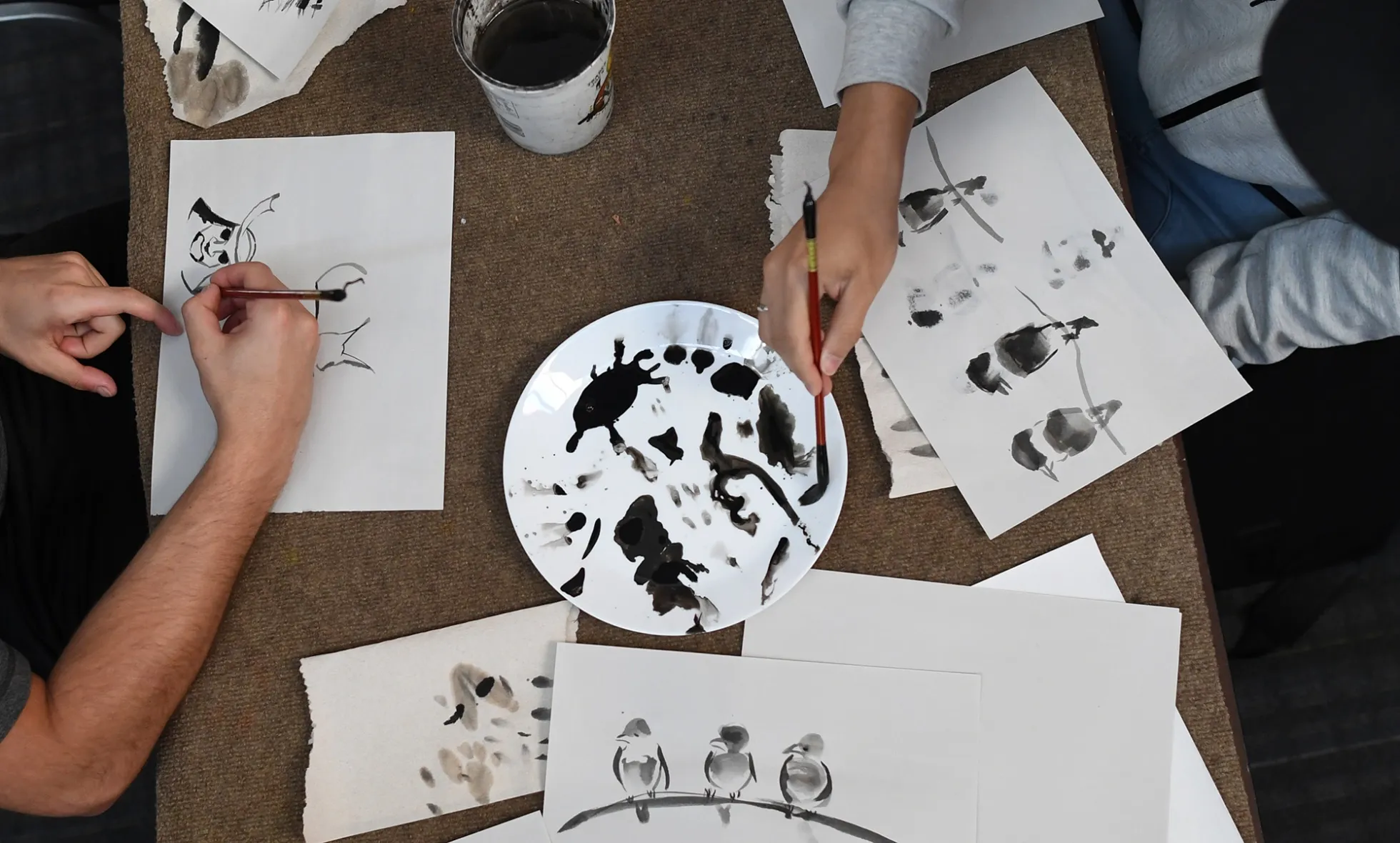 Students take a Chinese brush painting class as part of the Confucius Institute international network of classes in Denver in 2017.