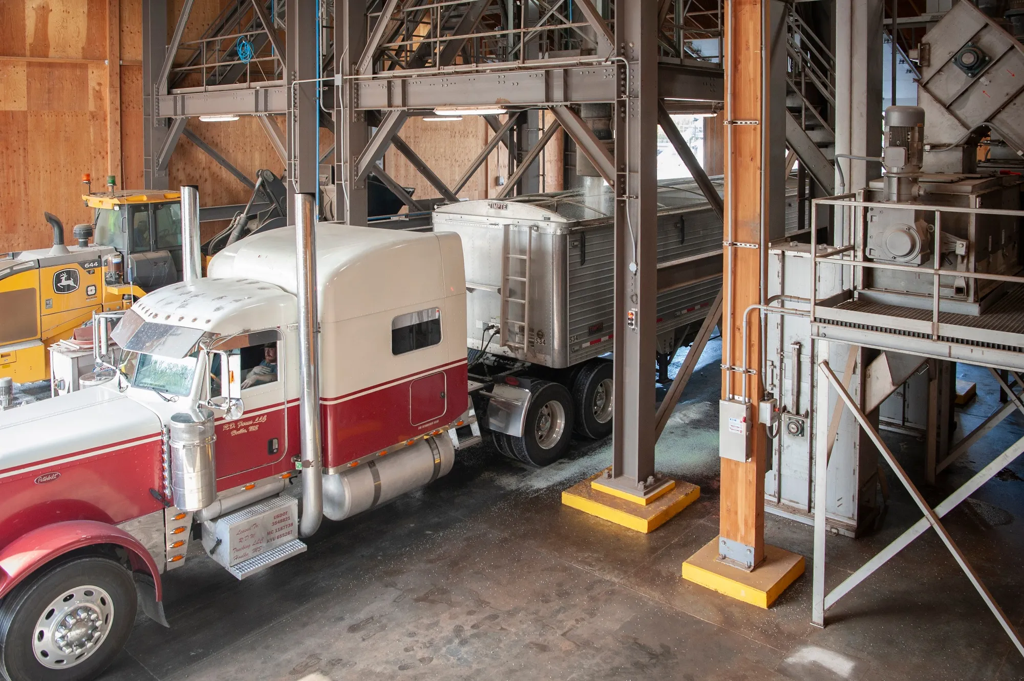 A fertilizer mixture is deposited into a farm truck at a warehouse at the Port of Rosedale in Rosedale, Mississippi.