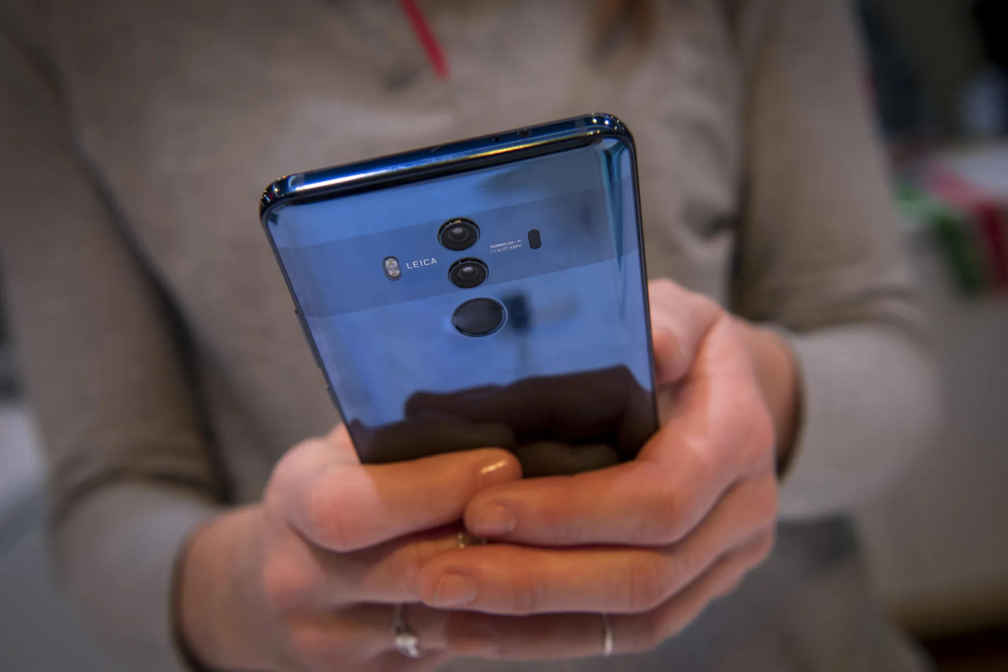 An exhibitor holds a Huawei Technologies Co. Mate 10 Pro smartphone during the 2018 Consumer Electronics Show (CES) in Las Vegas, Nevada, U.S., on Wednesday, Jan. 10, 2018.&nbsp;