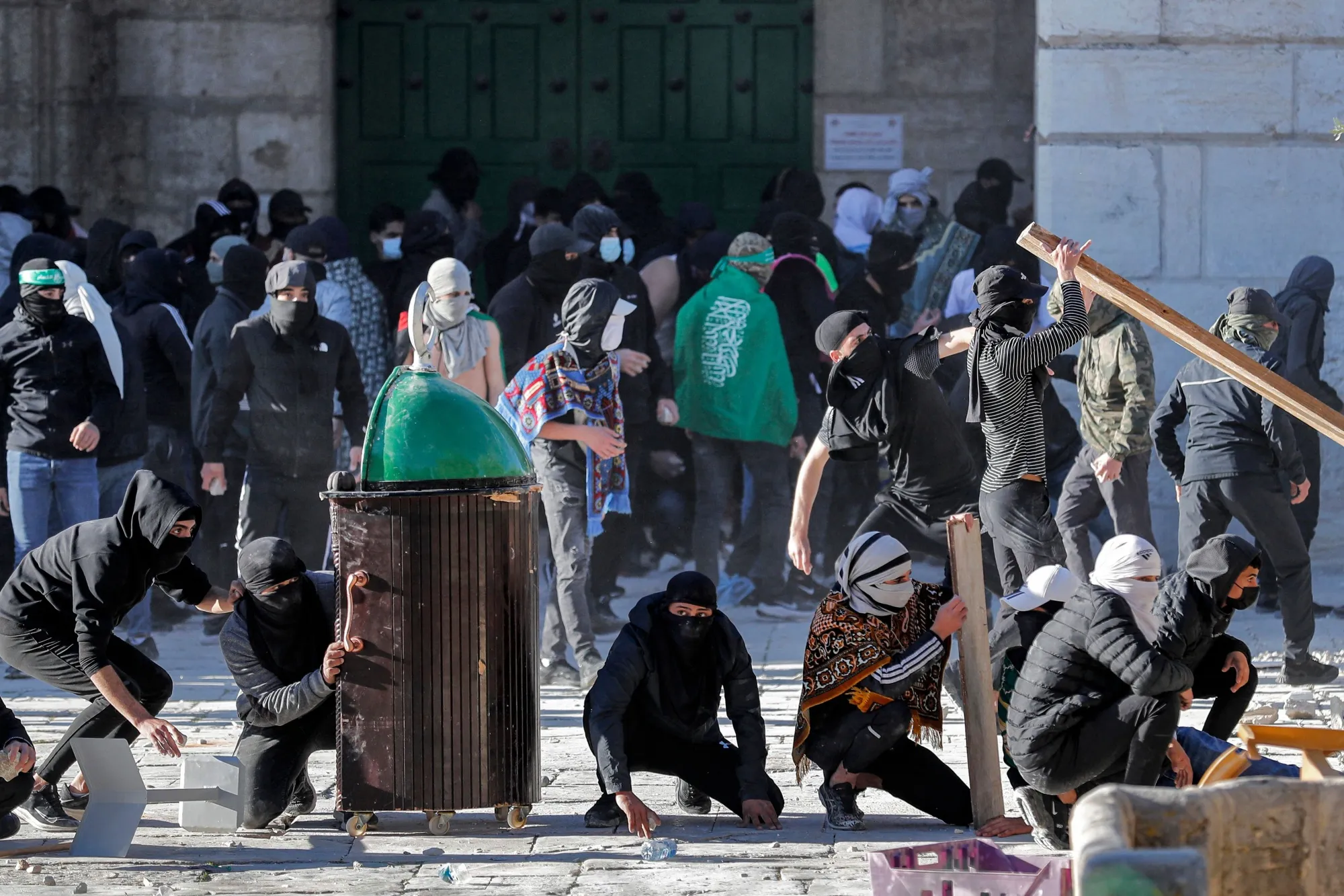 Palestinian demonstrators clash with Israeli police at Jerusalem's Al-Aqsa mosque compound on April 15.