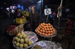 A&nbsp;vendor sells fruit at a market in Cairo.