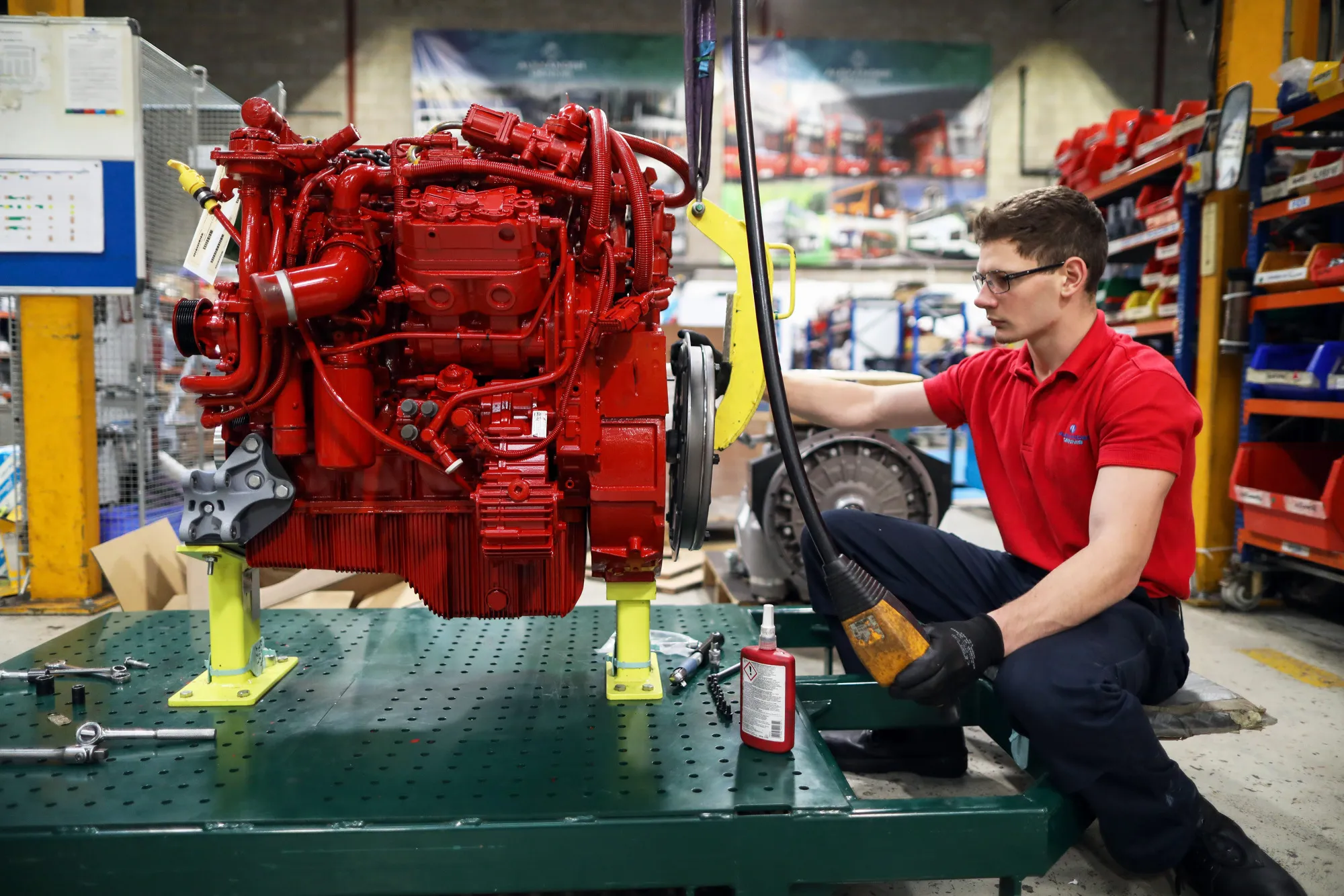 An apprentice works on the engine of an Enviro 200 bus at the Alexander Dennis Ltd. factory in Guildford, U.K., on Monday, Sept. 11, 2017. Manufacturing in the U.K. rose in July for the first time this year, boosted by a strong rebound in car production. Vehicle output, which had fallen sharply in recent months, surged almost 14 percent, the most since March 2009, helped by new models rolling off production lines.