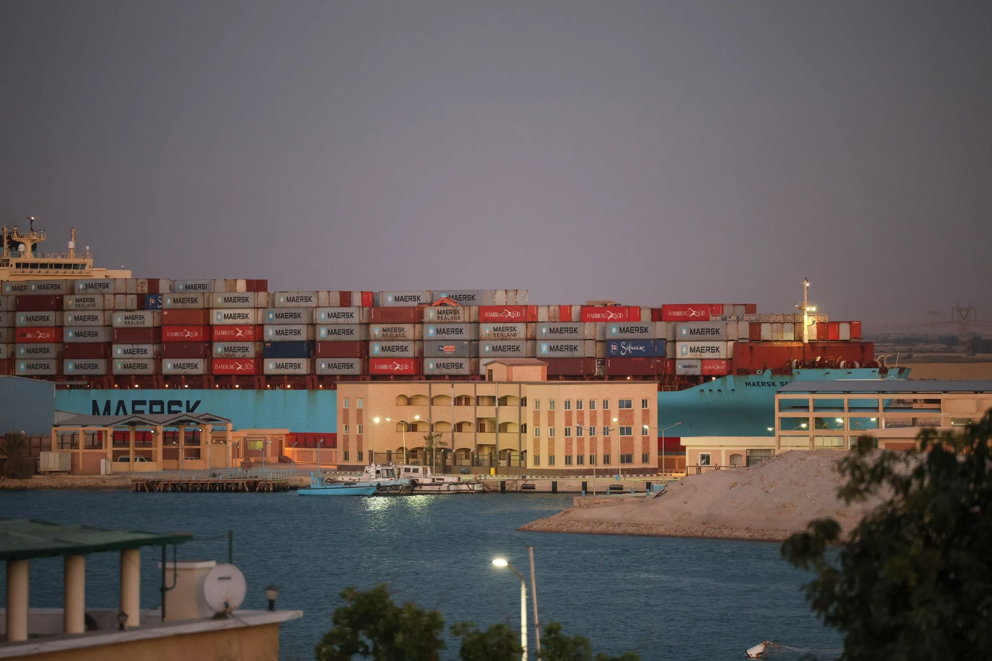 A container ship sails southbound to exit the Suez Canal in Suez, Egypt.