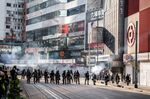 Riot police stand in a cloud of tear gas during a protest on Hennessy Road in Hong Kong on Nov. 2, 2019.&nbsp;