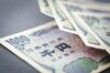 BERLIN, GERMANY - JULY 02: In this Photo Illustration japanese Yen bank notes, official currency of Japan, lie on a table on August 02, 2016, in Berlin, Germany. (Photo Illustration by Thomas Trutschel/Photothek via Getty Images)