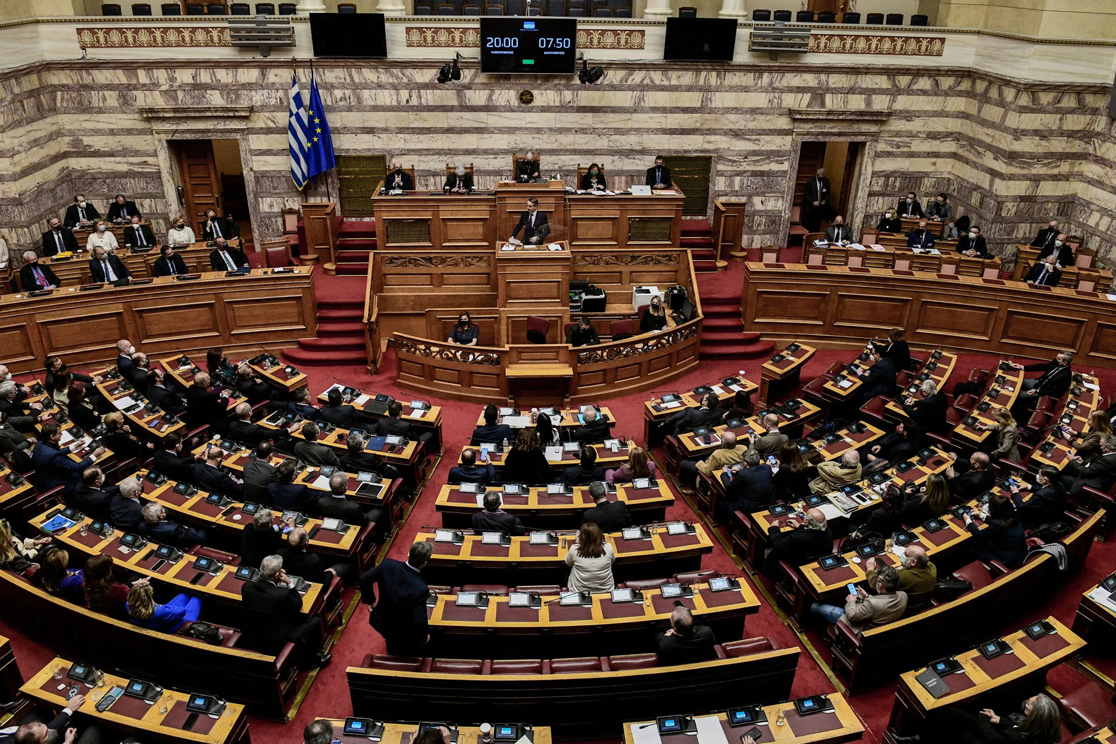 Kyriakos Mitsotakis speaks during a debate on the government's handling of a snowstorm,&nbsp;at the parliament in Athens on Jan.&nbsp;30, 2022.