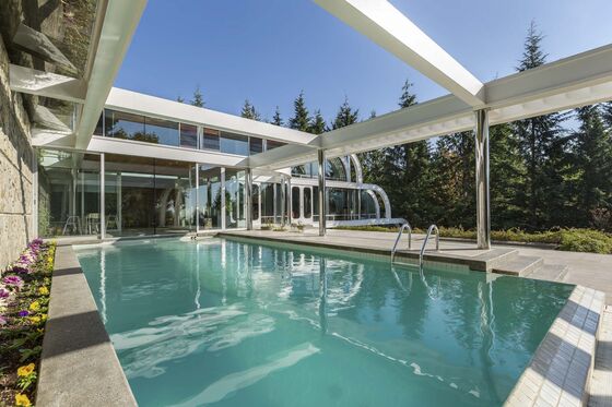 This $12.8 Million Canadian Mansion Is a Waterfall of Steel and Chrome