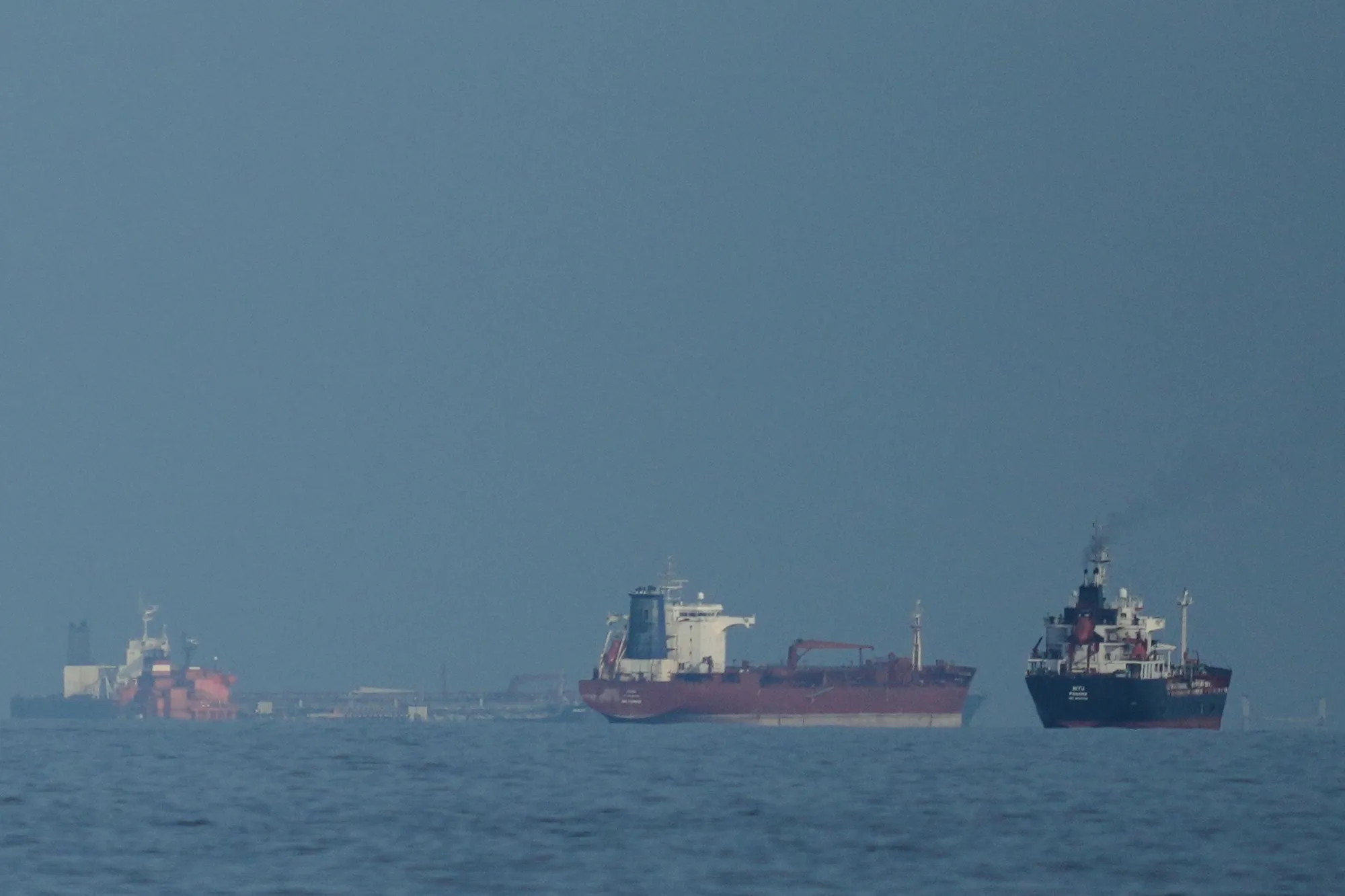 Oil tankers and cargo ships line up in the Strait of Hormuz on March 11.