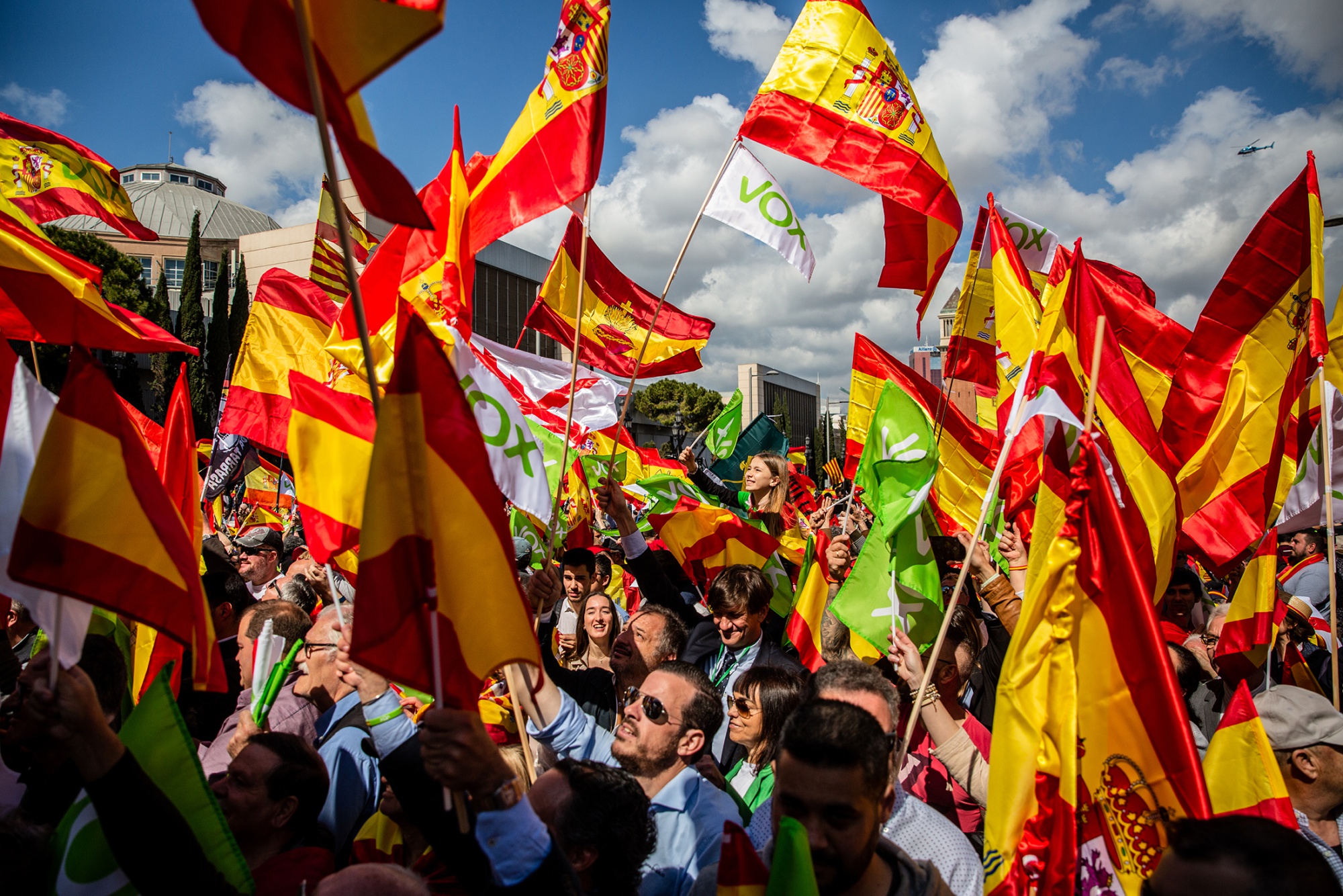 Attendees wave Spanish national flags during a Vox party rally in Barcelona on March 30.