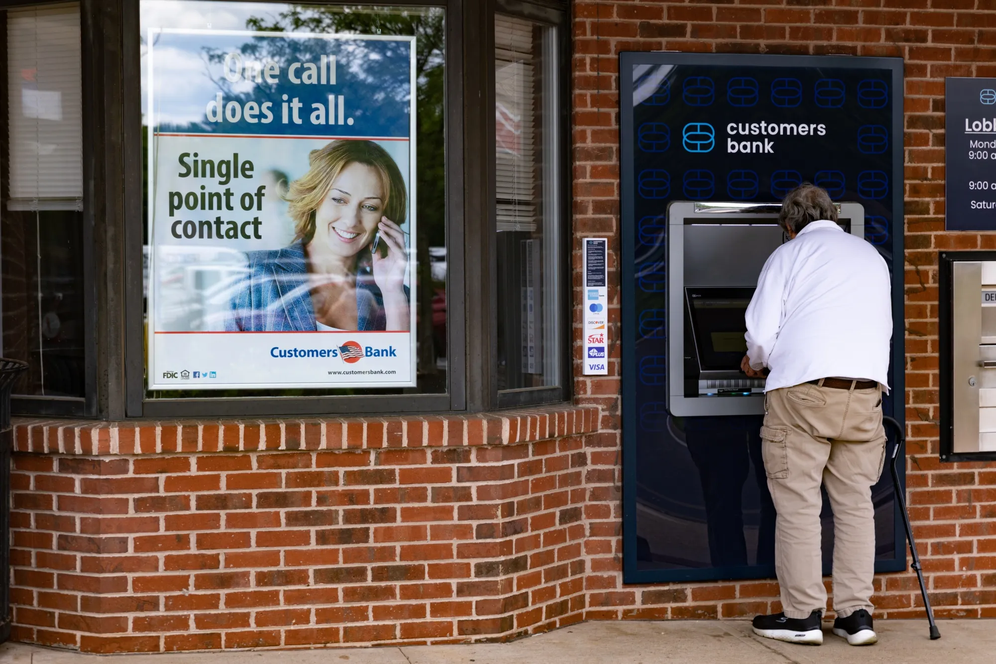 A customer uses the ATM at a Customers Bank branch in Doylestown, Pennsylvania, US, on Friday, June 9, 2023.