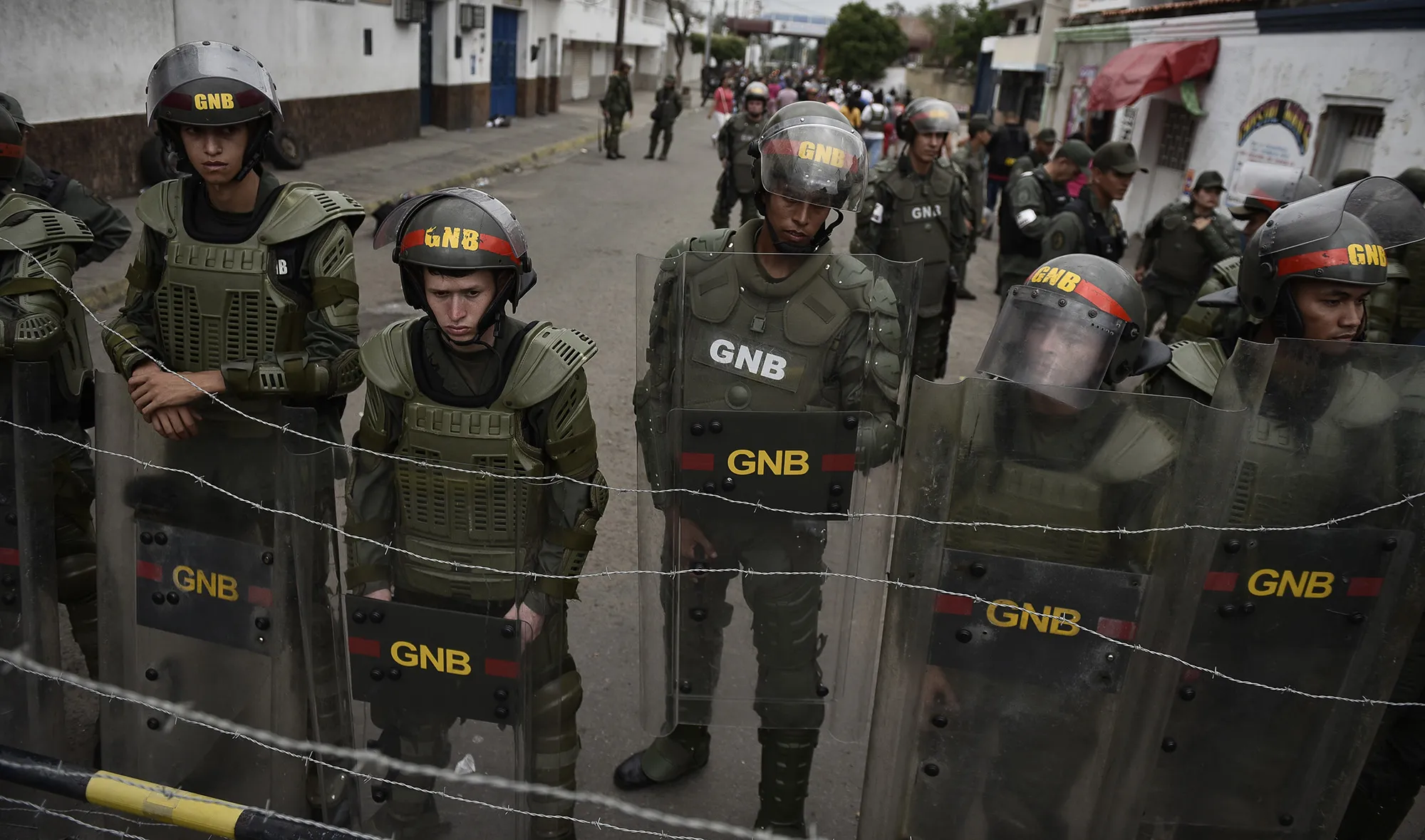 Members of the Bolivarian National Guard stand at a checkpoint near the border with Colombia in Urena, Venezuela.