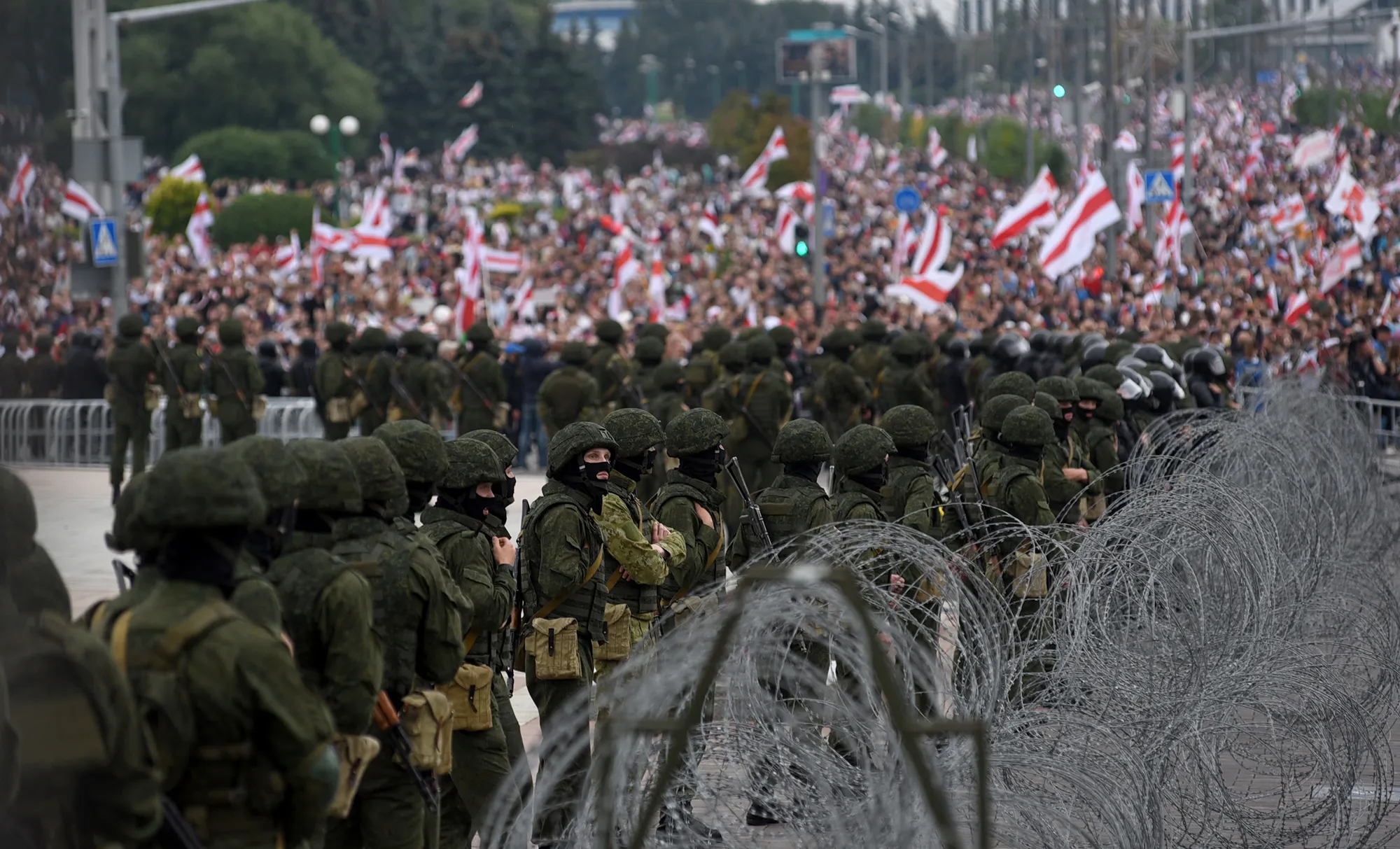 Security forces stand guard as people protest in Minsk&nbsp;on Aug. 23.