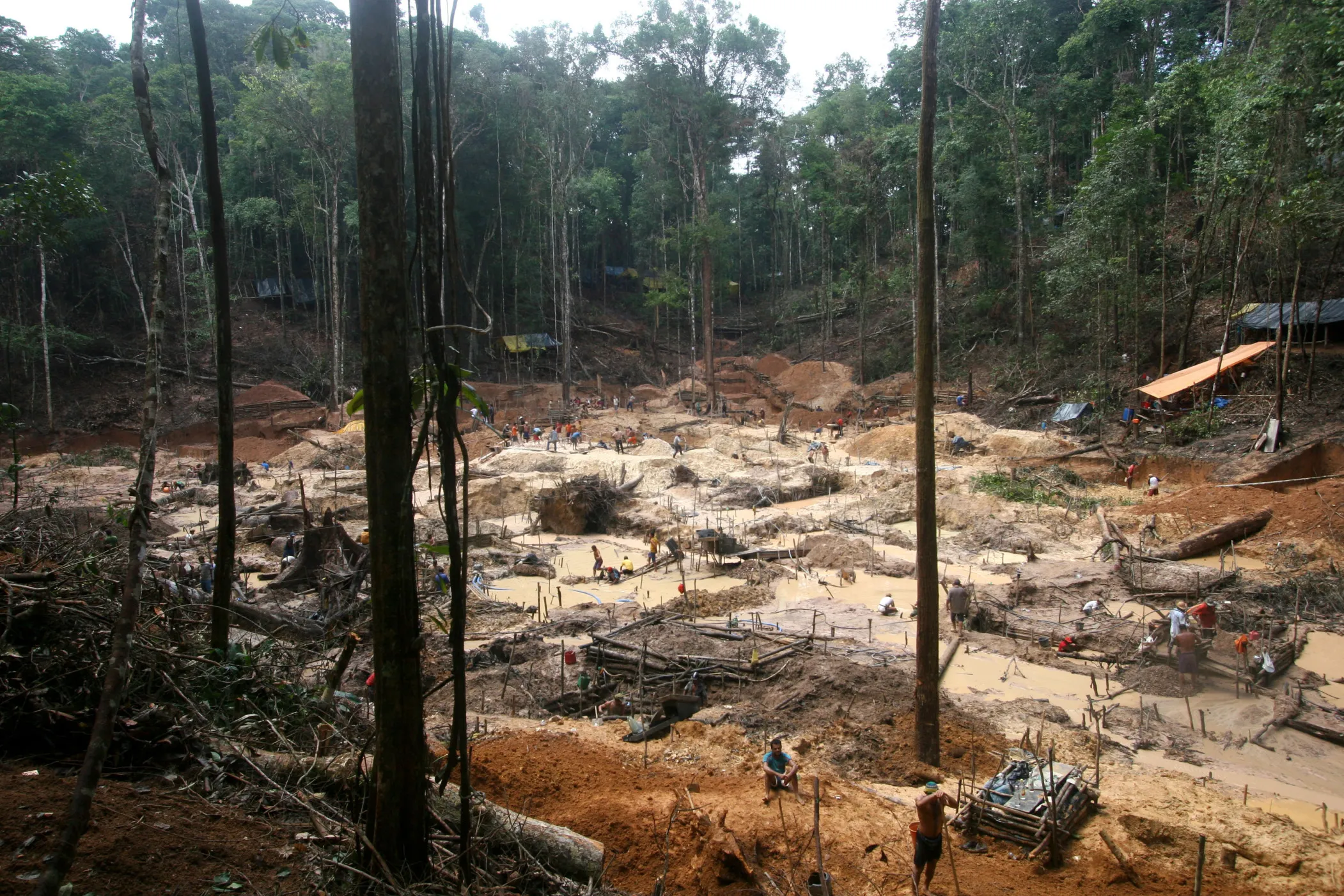 Gold prospectors at an open-air gold mine camp, in Novo Aripuana, in the Amazonas state of Brazil.