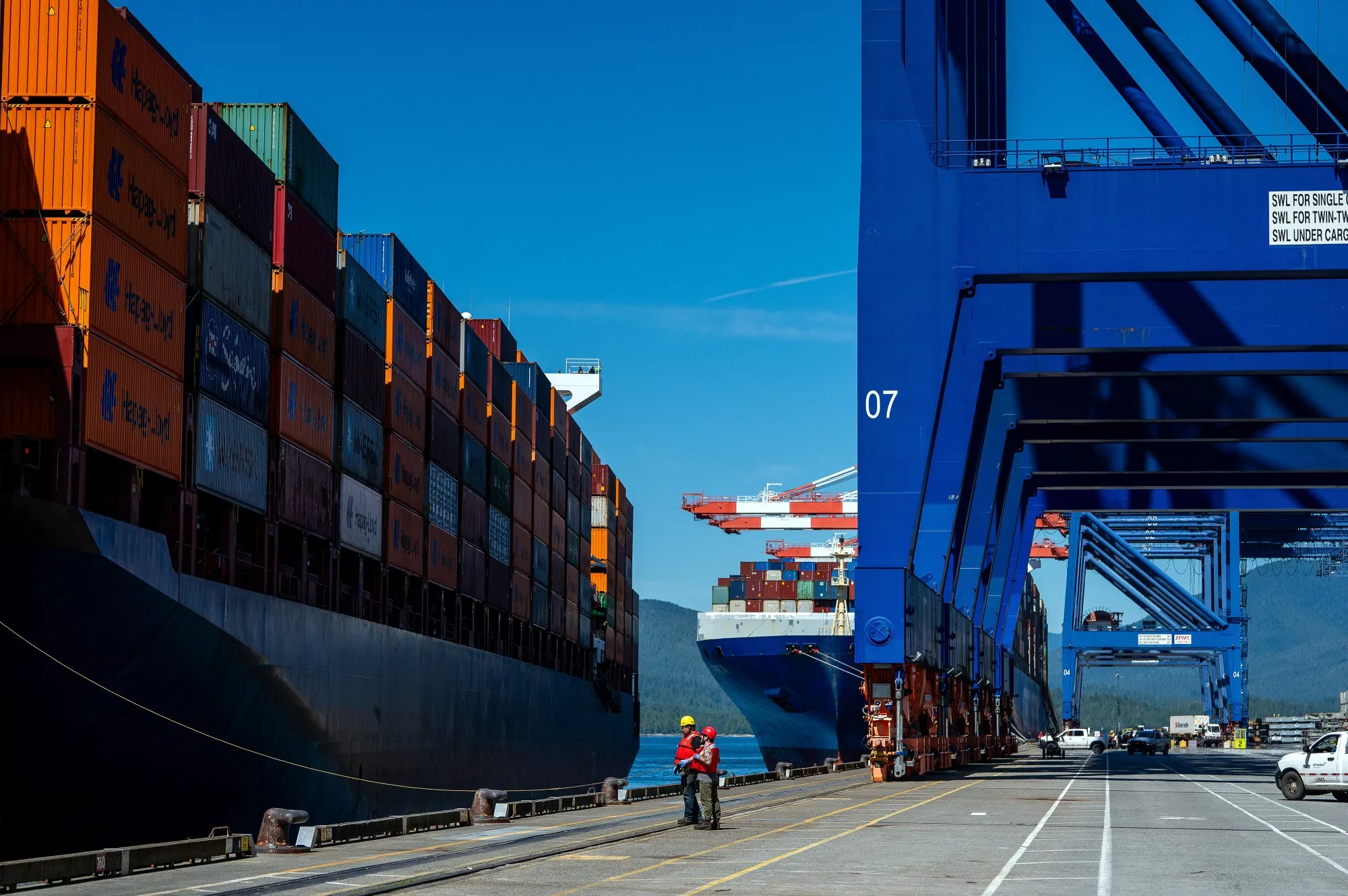 Mooring crews prepare to tie up a container ship arriving at the Fairview Container Terminal in the Port of Prince Rupert in Prince Rupert, British Columbia.