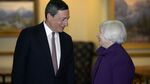Janet Yellen, chair of the U.S. Federal Reserve, right, speaks with Mario Draghi, president of the European Central Bank, during the Jackson Hole economic symposium, in Moran, Wyoming, on Aug. 22, 2014.

