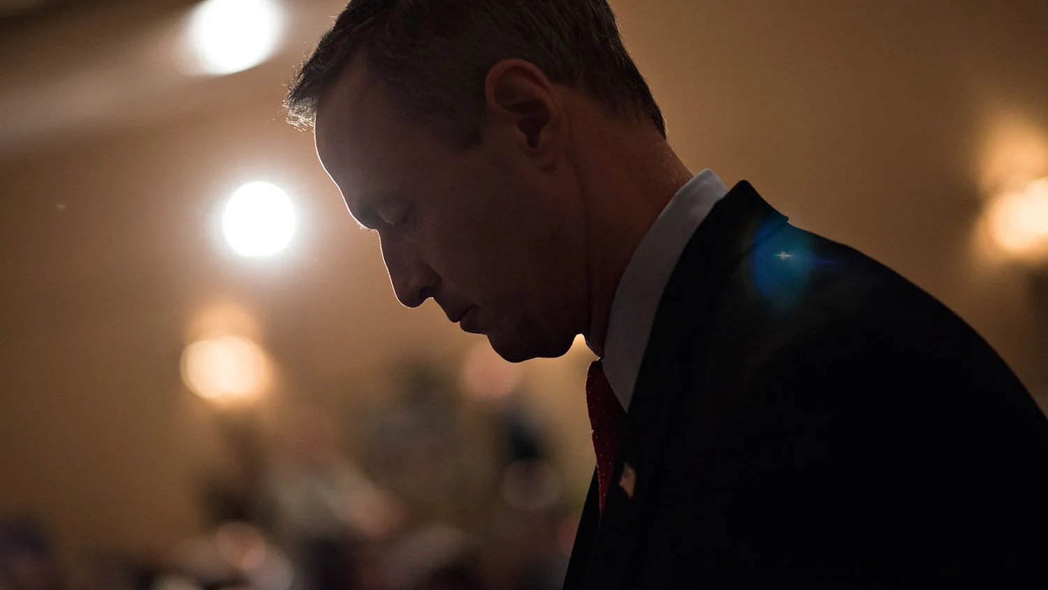 Martin O'Malley, former governor of Maryland and potential Democratic presidential candidate, listens to a speaker during the Scott County Democratic Party dinner in Davenport, Iowa, U.S., on Friday, March 20, 2015.
