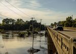 Vehicles travel on a bridge across the Pearl River during a water shortage in Jackson, Mississippi, on Sept. 1.