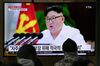 People watch a television news program showing Kim Jong Un in Seoul on Dec. 30.