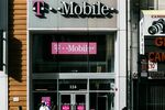 T-Mobile US Inc. signage is displayed on the exterior of a store location in New York, U.S.