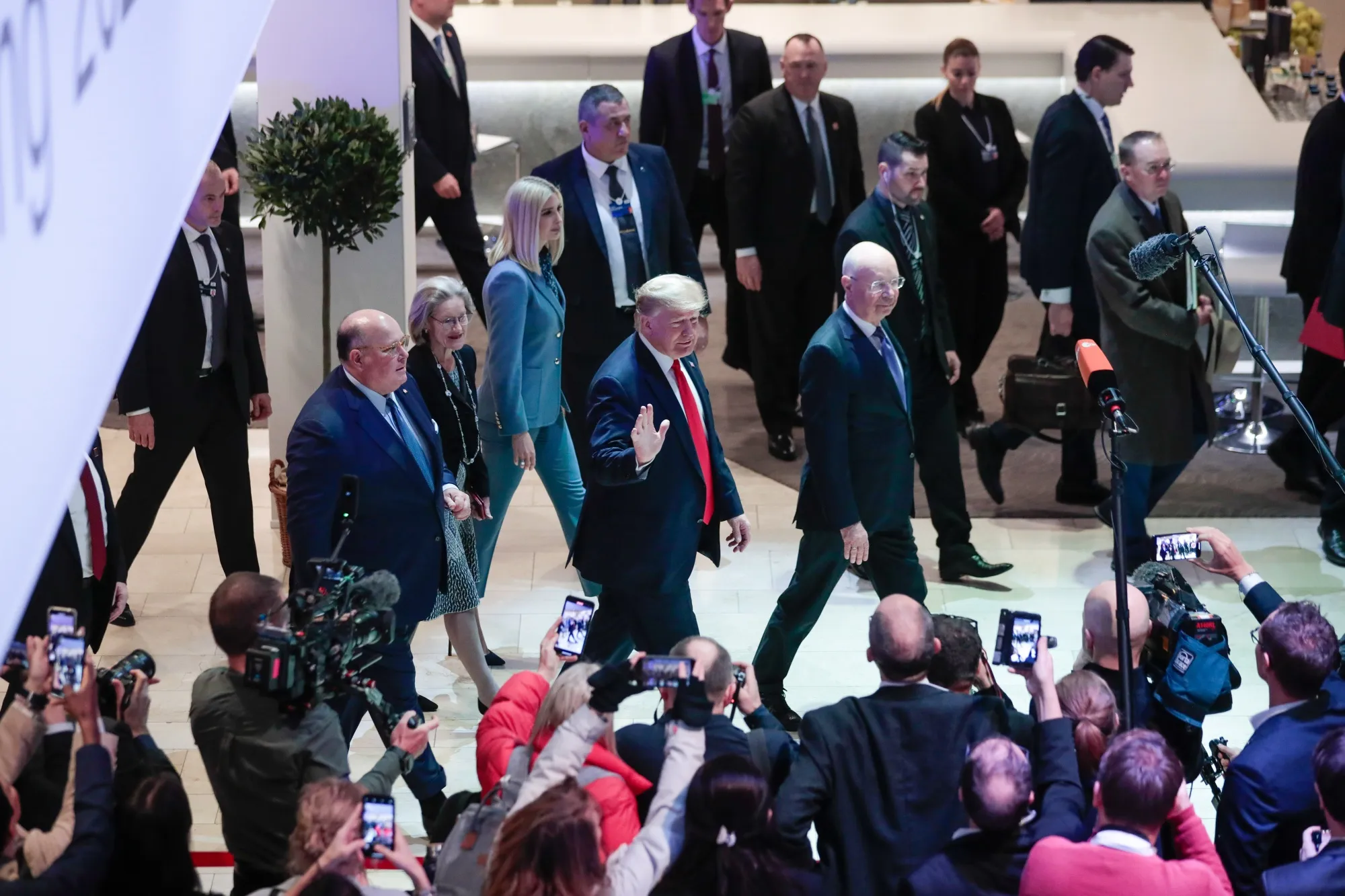 Donald Trump waves to members of the media as he arrives on day two of the World Economic Forum in Davos, on Jan. 22.