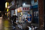 A half empty street at a night market in Taipei.&nbsp;