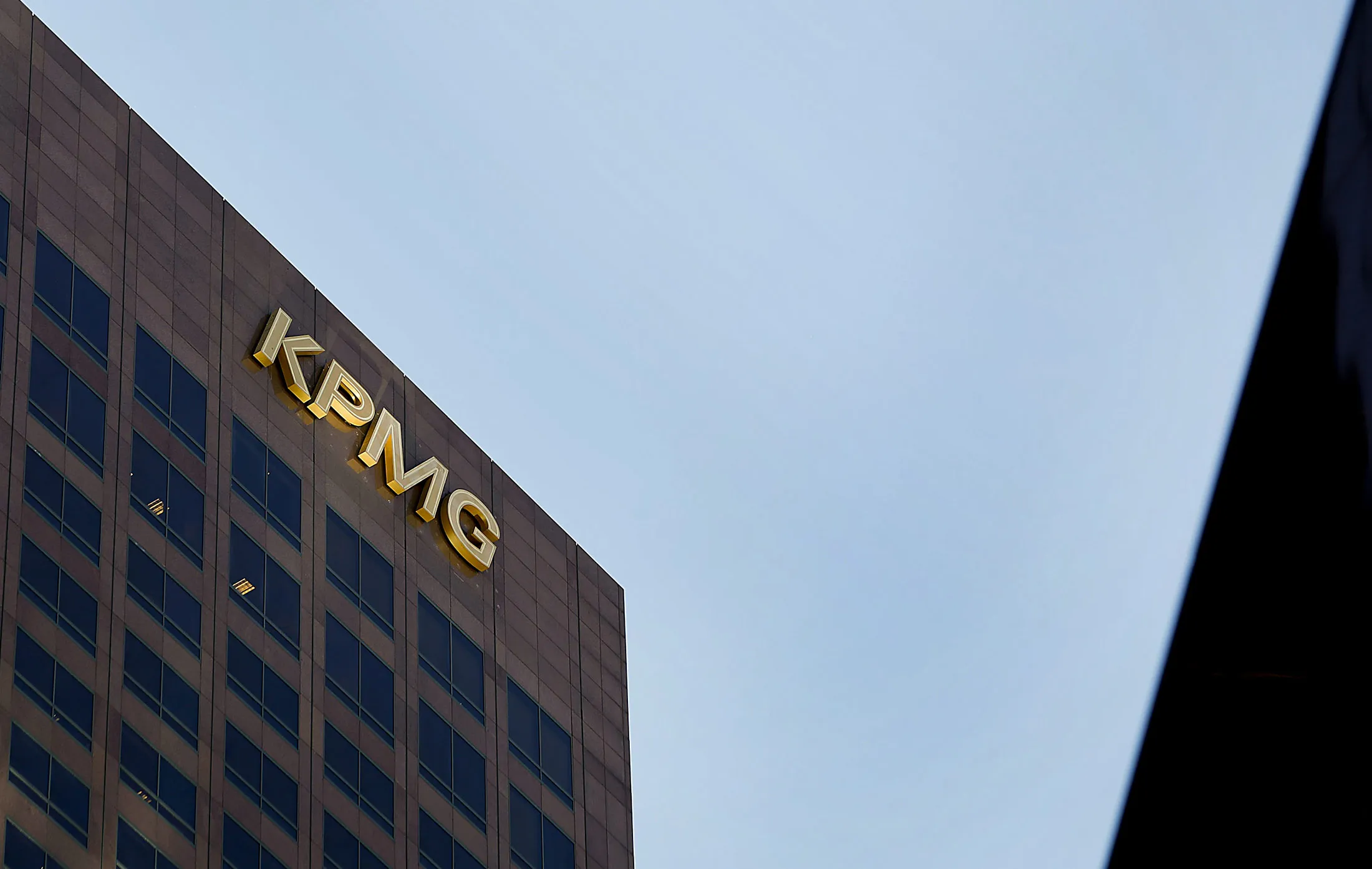 The offices for the accounting firm KPMG LLP stand in Los Angeles, California, U.S., on Tuesday, April 9, 2013. KPMG LLP resigned as the auditor for two companies and fired the partner overseeing its Los Angeles audit practice amid allegations the person leaked confidential client information to a third party who used it to make stock trades.
