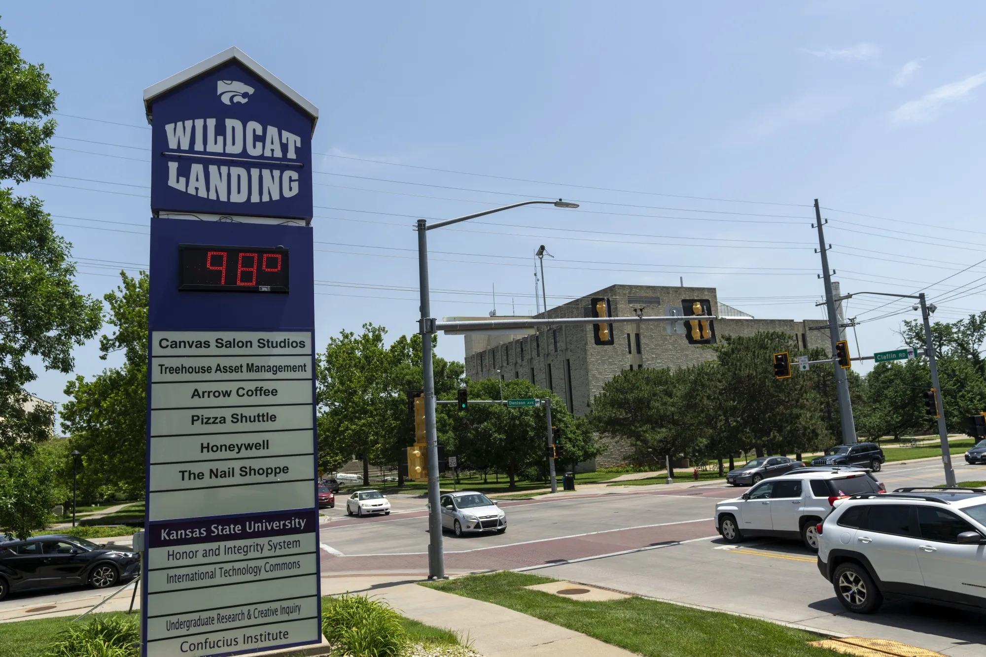 The temperature reads 98 degrees on Kansas State University signage in Manhattan, Kansas on Friday, June 17, 2022.