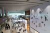 Travelers walk past stores inside the terminal 2 building at Incheon International Airport in Incheon, South Korea, on Thursday, Jan. 18, 2018. The new terminal opens today.