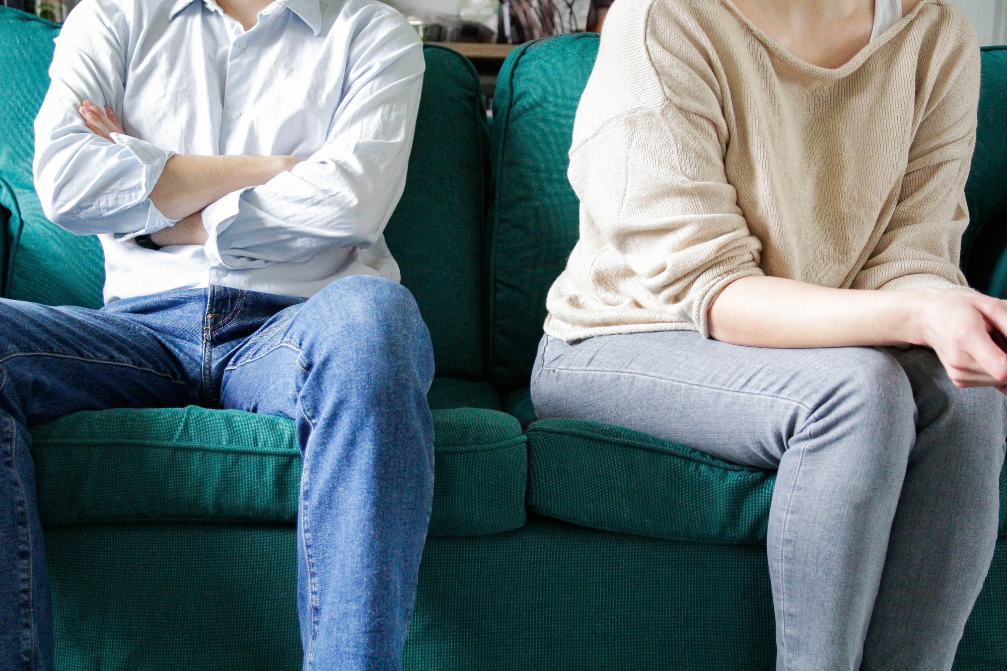 A couple sitting on a sofa. Photographer: Kinga Krzeminska/Moment RF/Getty Images