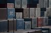 Containers sit stacked at a shipping terminal in Yokohama, Japan, on Monday, Feb. 18, 2019. Japan is sticking to its view that the U.S. won’t apply higher tariffs on imports of Japanese cars and auto parts so long as negotiations toward a trade deal continue, according to Tokyo’s lead negotiator with Washington. Negotiations over a trade deal announced last September by Trump and Abe have yet to start, partly due to ongoing talks between Washington and Beijing.